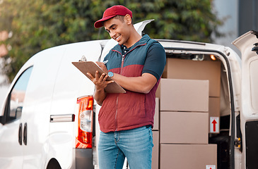 Image showing Delivery, inventory and courier writing on paperwork while working in the ecommerce business. Happy, young and logistics worker with smile for documents, paper and transportation of boxes in a van