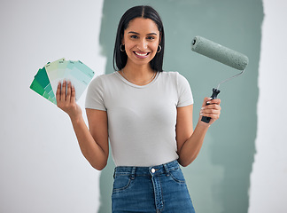 Image showing Color card, renovation and woman painting a house, home or apartment room wall green for maintenance. Artistic, designer and creative painter holding a roller and color palette with a happy smile