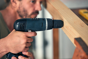 Image showing Man, drill wood and build for home interior or wardrobe renovation. Professional carpenter, house construction improvement and focused handyman maintenance worker drilling hole in wooden bar