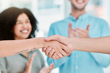 Image showing Business deal, handshake and partnership with employees shaking hands in b2b office agreement after negotiation. Hiring, closeup and hands of man and woman partner celebrate collaboration success