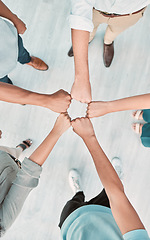 Image showing Fist bump, team building and business people in collaboration for success, mission goals and company sales targets. Top view, support and startup workers meeting with trust, teamwork and our vision