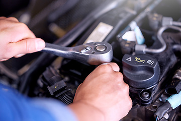 Image showing Hands, engine and mechanic with a man engineer working with a spanner tool under a car hood in a workshop. Worker, industry and engineering with a male maintenance professional at work in his garage