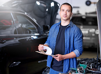 Image showing Car, engineering and mechanic with a checklist at a workshop or garage for auto inspection and maintenance. Industrial, services and worker working on motor oil, pipe leaks repair and checking safety