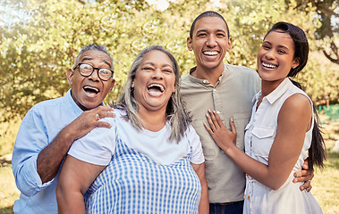 Image showing Happy family, laughing and relax at a park together with couple bonding with senior parents in nature. Love, family and reunion in a forest with portrait of laughing people enjoying quality time