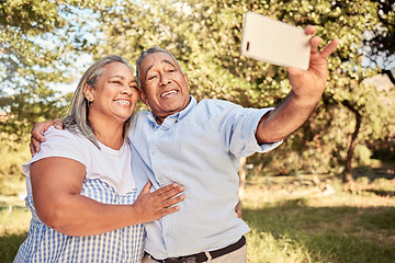 Image showing Love, phone and old couple taking a selfie in nature on a happy retirement holiday vacation in summer in Brazil. Smile, freedom and senior woman enjoys taking pictures or photo outdoors with partner