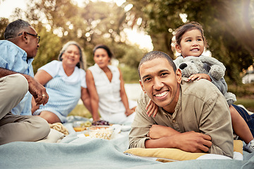 Image showing Happy, father and child on a picnic at a park with family for food, adventure and love on a holiday in Germany together. Portrait of a dad with smile for lunch in nature with a girl, parents and mom