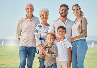 Image showing Happy, big family and nature park vacation together with grandparents in retirement, children and parents smile. Summer holiday, relax outdoors and portrait of generations love bonding field of grass