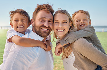 Image showing Family, beach and piggy back portrait with young children for holiday fun in summer with parents. Smile of happy kids with mother and father holding them at Australia ocean for vacation bonding.