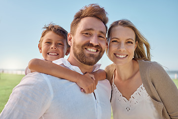 Image showing Family, children and piggyback with a man, woman and son outdoor on a field during a vacation or holiday together. Kids, travel and love with a mother and father bonding with their boy child outside