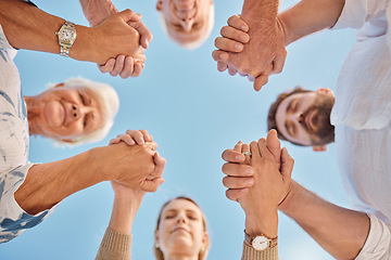 Image showing Family, group and holding hands in circle for praying, faith and bonding together outdoor. Mom, dad and grandparents with spiritual, sky and religion for God, happiness and closed eyes in gratitude