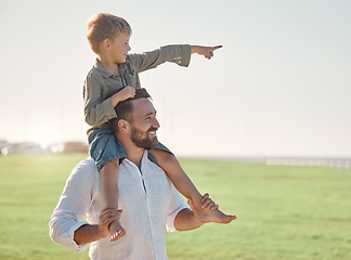 Image showing Father, kid and bonding outdoor in nature looking at a view with happiness and family care. Happy dad and kid together with a smile enjoying a summer day and vacation on a grass field with a child