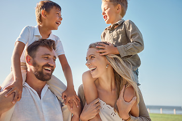 Image showing Happy family, travel and beach, kids relax on holiday while playing a shoulder game and having fun at the sea. Family, love and parents carrying children on an ocean trip in Miami, laughing and happy