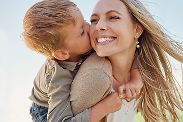 Image showing Kiss, mother and child with smile in a park for relax, adventure and peace together in summer. Face of a happy, thinking and young mom with her kid kissing and hugging her in nature with a piggyback