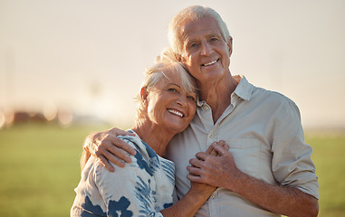 Image showing Senior couple smile and happy with love outdoor at a forest, care and hug. Elderly man and woman portrait, happiness and peaceful day in nature, enjoying retirement and healthy relationship on field