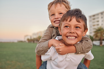 Image showing Happy, smile and portrait of brothers with piggyback ride playing in a park together on vacation. Happiness, excited and children bonding in nature while on a summer holiday adventure in Australia.