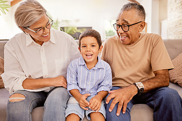 Image showing Relax, happy and grandparents with child on sofa together for smile, love and retirement. Peace, youth and portrait of old man and woman with kid in living room in family home for care, hug and calm