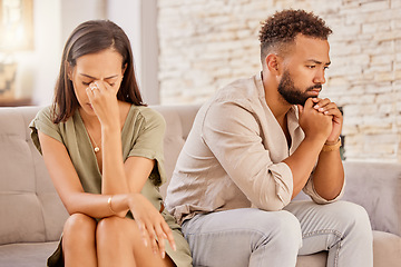 Image showing Couple, divorce or stress on living room sofa in house, home or marriage counseling after fight, argument or affair. Sad, anxiety or depression for man or woman with mental health or breakup burnout