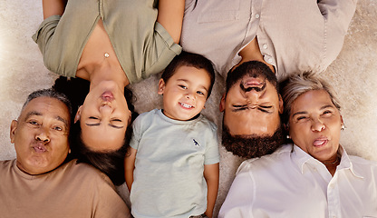 Image showing Relax, portrait and happy family with funny faces or crazy facial expressions lying on a floor, top view. Grandparent, mother and father love freedom, bonding and enjoy quality time at home together