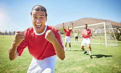 Image showing Soccer player, celebrate and winning team with fist in celebration of scoring goal for sport match, game or competition with success gesture. Victory and fun with men training on football field