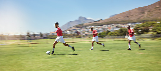 Image showing Soccer player, running and soccer ball team sports competition game, grass pitch and goals of winning score in South Africa. Motion blur professional athlete, football field action and outdoor energy
