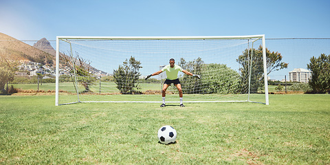 Image showing Goalkeeper, soccer field and sports man ready in penalty kick, competition game challenge and football field pitch defense. Goalie protect net goals, stop soccer ball score and football player target