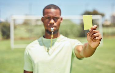 Image showing Soccer, referee and yellow card with a black man giving a caution to a player during a game outdoor. Football, fitness and exercise with a young male booking an athlete during a match outside