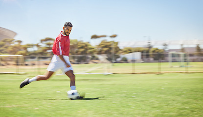 Image showing Football, running and soccer man with a ball doing a sport exercise, workout and training. Speed, action and young male athlete in a sports team uniform run a fitness cardio on a grass field