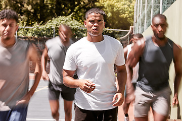Image showing Men, group and running on basketball court for exercise, training and teamwork together in the sun. Team, basketball and fast people in workout and fitness for wellness, sports and health