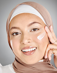 Image showing Skincare cream, hijab and muslim woman with a smile using beauty lotion and skin moisturizer. Portrait of a happy face of a person from Iran using a cosmetic serum for anti aging and wellness