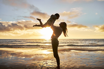 Image showing Mother, girl and sunset silhouette at beach while play, lift and love during summer vacation in Hawaii. Woman, child and energy with fun, carry and care during family travel holiday at Hawaii sea