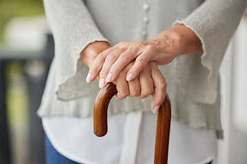 Image showing Hands, walking cane and senior woman with disability leaning for help, balance and support at nursing or retirement home. Hand, mature and mobility stick for disabled elderly lady in physical therapy