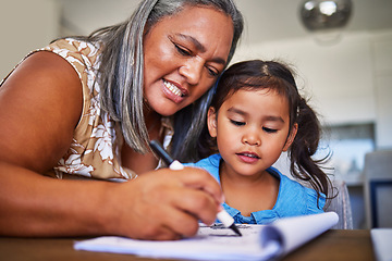 Image showing Girl homework, learning and grandmother helping child with school education in a notebook in their home. Kid and senior woman, creative drawing or homework writing for knowledge and learning alphabet