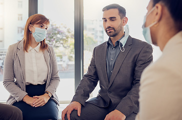 Image showing Covid, business people and office meeting with leader, manager or coach talking for counseling, therapy or support. Corporate women and man group with face mask during coronavirus for development