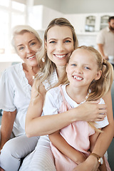 Image showing Happy woman in family, home with grandmother and girl child portrait together on sofa in Dublin. Elderly grandma in lounge with women, mama in living room holding daughter and love on mothers day