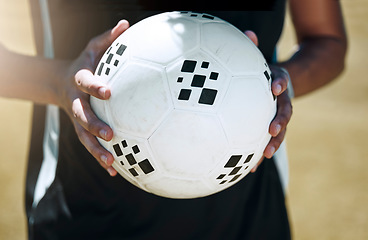 Image showing Soccer, hands and ball with a sports man on a grass pitch or field for fitness and exercise outdoor. Football, health and training with a male football player at a sport venue for a cardio workout