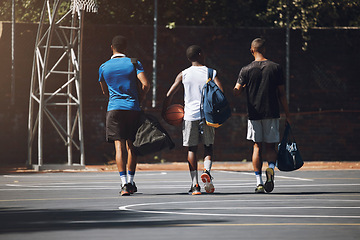 Image showing Basketball court, men and friends walking in sports ground for athlete game training and workout. Black people, basketball and fitness together for team tournament preparation at outdoor court.