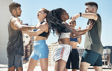 Image showing Soccer, sport and fight with a woman player pushing a man athlete during a game or match outdoor on a rooftop. Football, fitness and competition with a team fighting during a sport rivalry