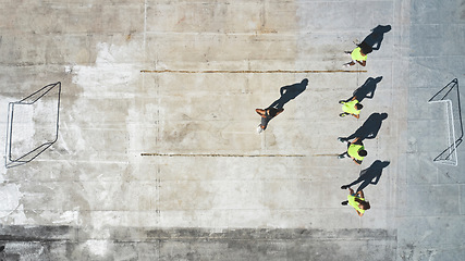 Image showing Sports, soccer player and team with coach stretching, working on game fitness, competition warm up or exercise top view. Street football, commitment and man coaching men, athlete or training workout