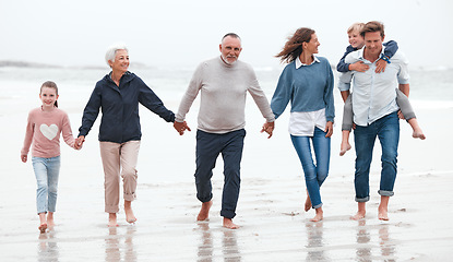 Image showing Beach, walking and big family on exercise while on vacation in Australia during summer in water. Happy Grandparents, parents and children on outdoor health walk while on adventure, journey or holiday