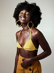 Image showing Beauty, black woman and portrait with afro and bikini fashion top showing glowing skin in studio. Happy, cheerful and edgy african girl with natural hair and trendy yellow makeup with mockup.