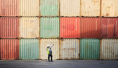 Image showing Logistics, shipping yard and cargo containers manager woman talking on phone for communication for import and export at a shipyard. Female engineer and supply chain worker at a port in South African