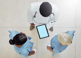 Image showing Topview of doctors, tablet green screen and nurses mockup of hospital for patient healthcare with professional consultation. Digital health report, medical diagnosis and consulting colleagues at work