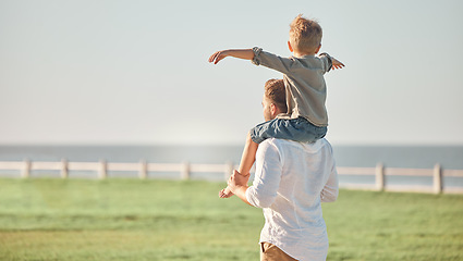 Image showing Father, child and shoulders for walk in nature spending quality time or bonding together in the outdoors. Dad and kid walking enjoying freedom adventure for love, care and piggyback in South Africa