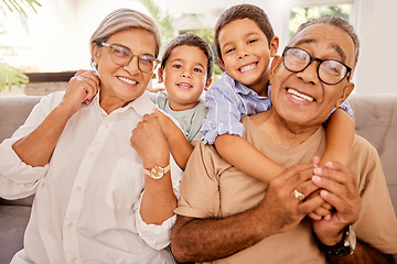 Image showing Love, happy family and kids relax with grandparents on a sofa, hug and bonding in a living room. Portrait, seniors and children embracing, laughing and enjoying visit to grandma and pa on the weekend