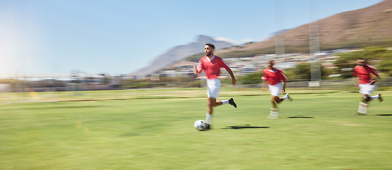 Image showing Sports, youth development and soccer players running on field with ball for game, goals and winning. Football, teamwork and a training match on the grass and practice with soccer ball to score goal.