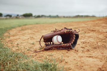 Image showing Sports, baseball gloves and field ball on dirt floor after game, competition or practice match for fitness, exercise or health. Softball pitch, training ground or baseball field equipment for workout