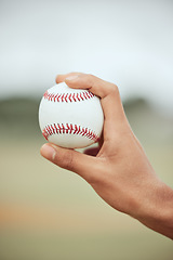 Image showing Baseball player, hands and ball pitcher, sports goals and skill in competition games, action and outdoor training. Softball athlete holding catch, fitness and practice on field, stadium and equipment