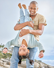 Image showing Happy family, beach and father with daughter having fun upside down fun on Florida vacation. Family, girl and parent in carry flip at sea in Mexico, laughing, happy and enjoying their bond in nature