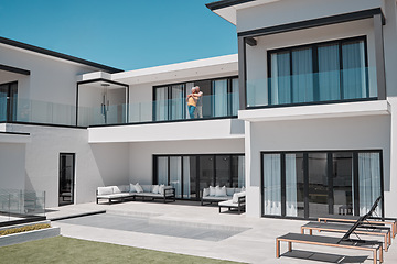 Image showing Property, house and senior couple on balcony enjoying sunny day in luxury family home. Retirement, real estate and rich elderly man and woman hugging, embrace and bonding in double story dream home