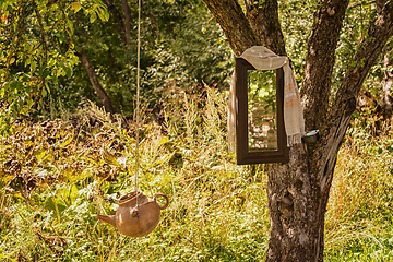 Image showing Washstand and mirror on a tree